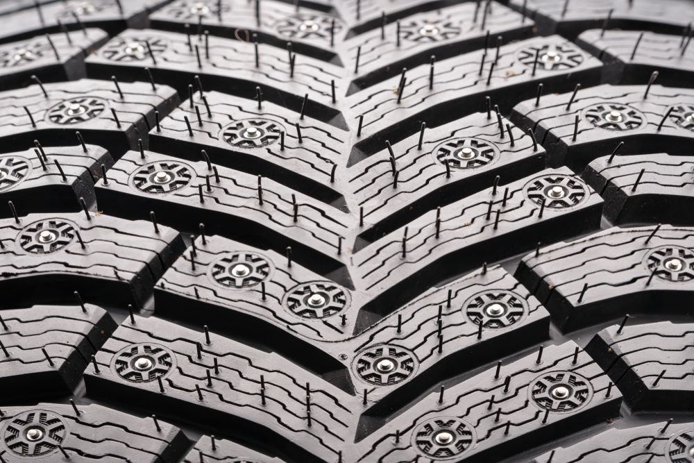 winter tire has more grooves, tread depth and studs